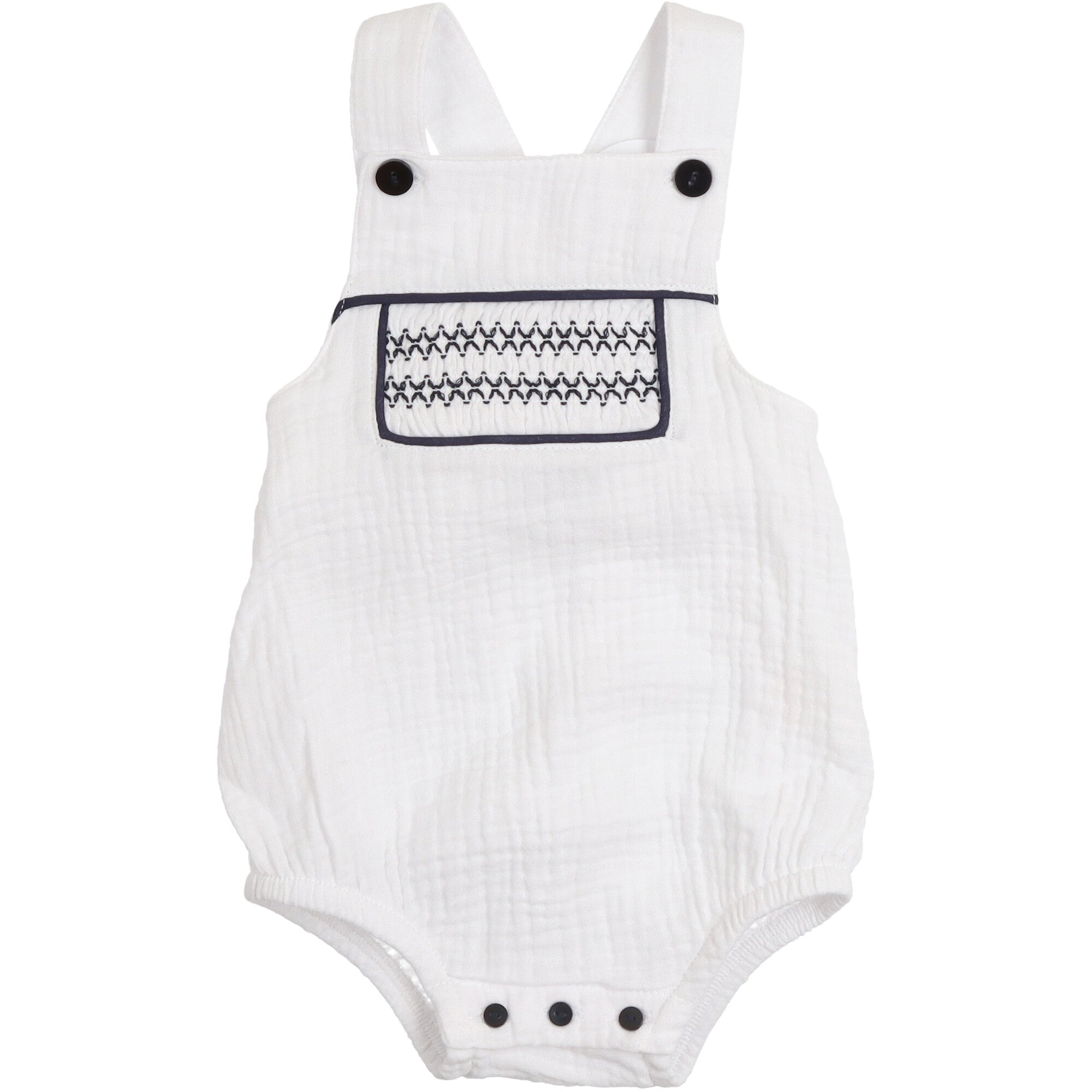 Pagliaccetto neonato in mussola bianca con spalline incrociate ricamo smock blu navy e bottoni decorativi sul petto
